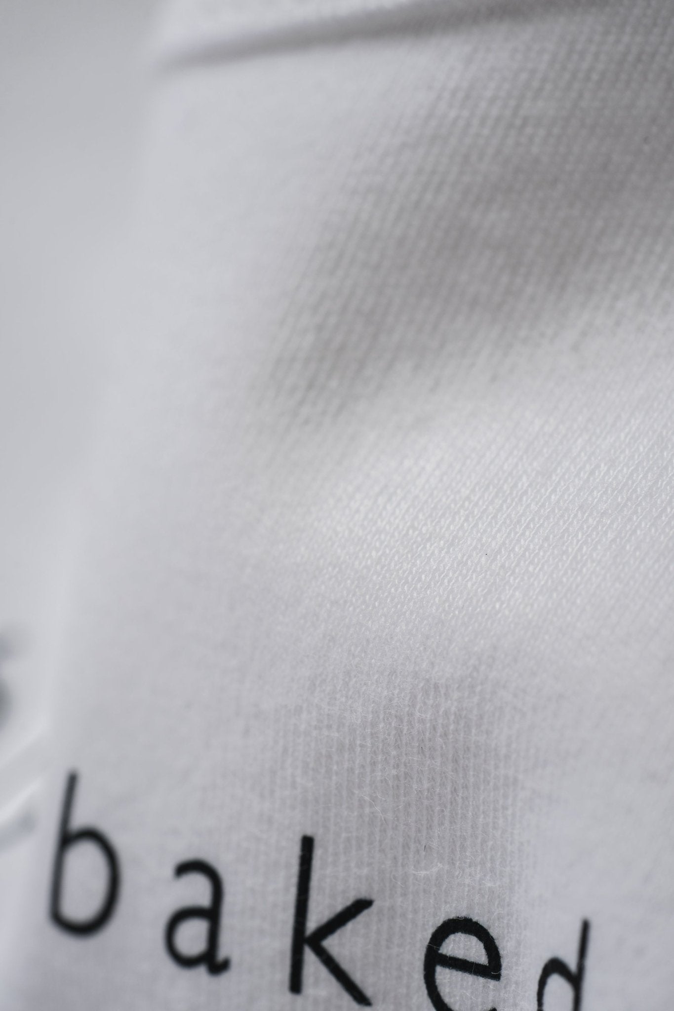 'Freshly Baked' baby bun Onesie in White